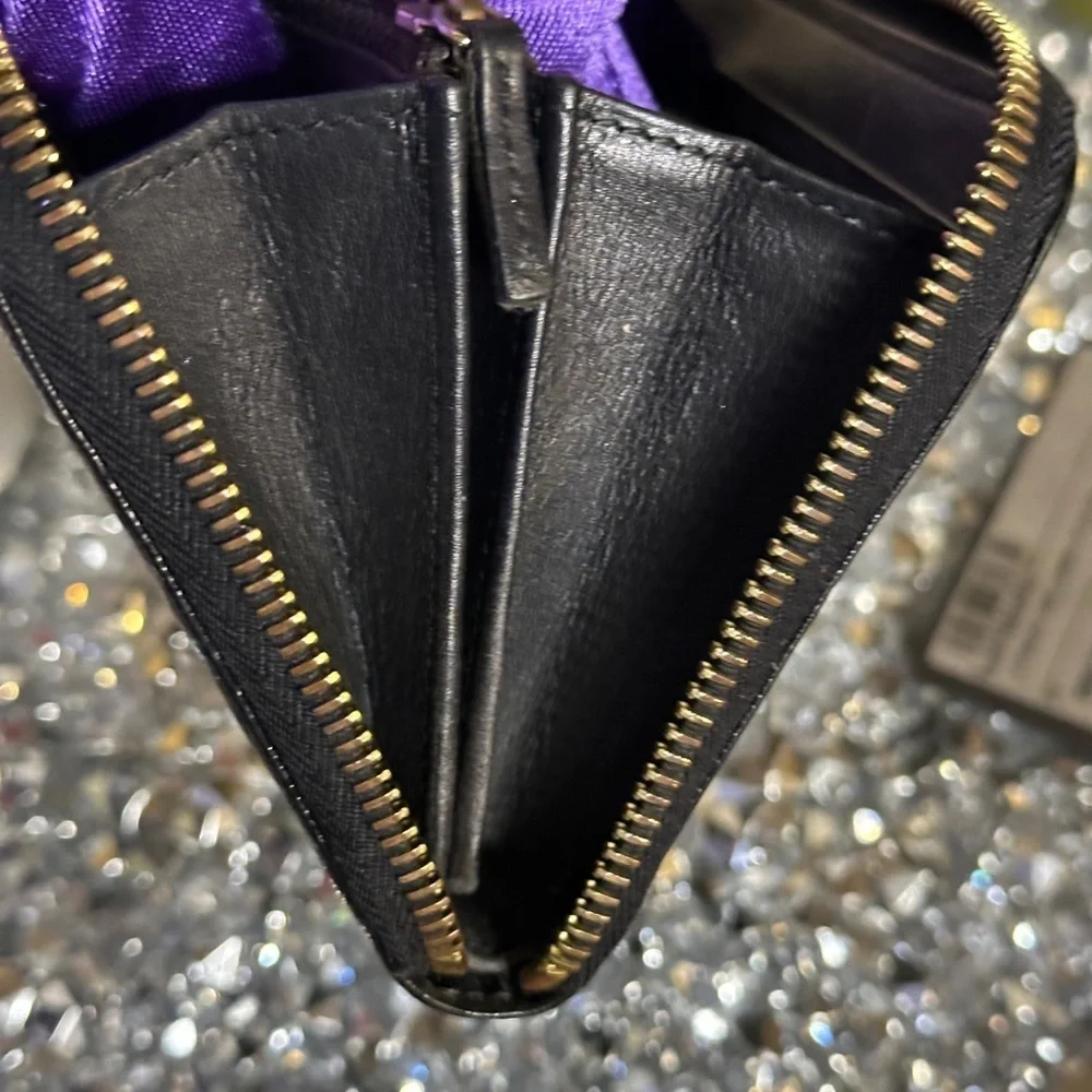 Vintage Fendi black patent leather zip-around continental wallet.